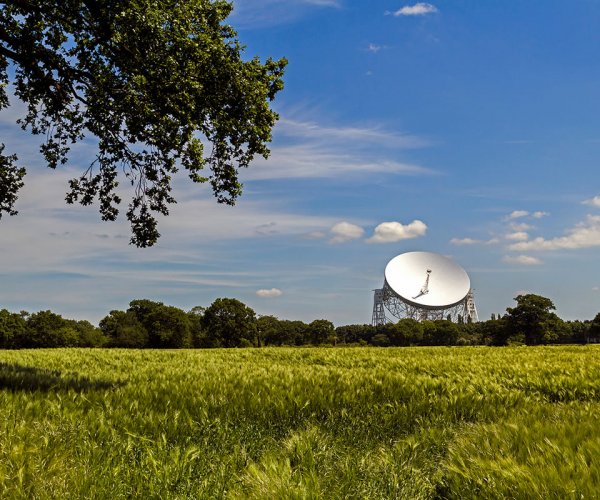 Lovell Telescope at Jodrell Bank Observatory viewed from a green field in Cheshire